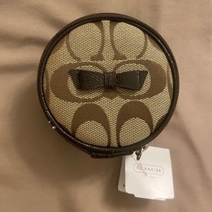 Authentic Coach jewelry pouch with bow, small
